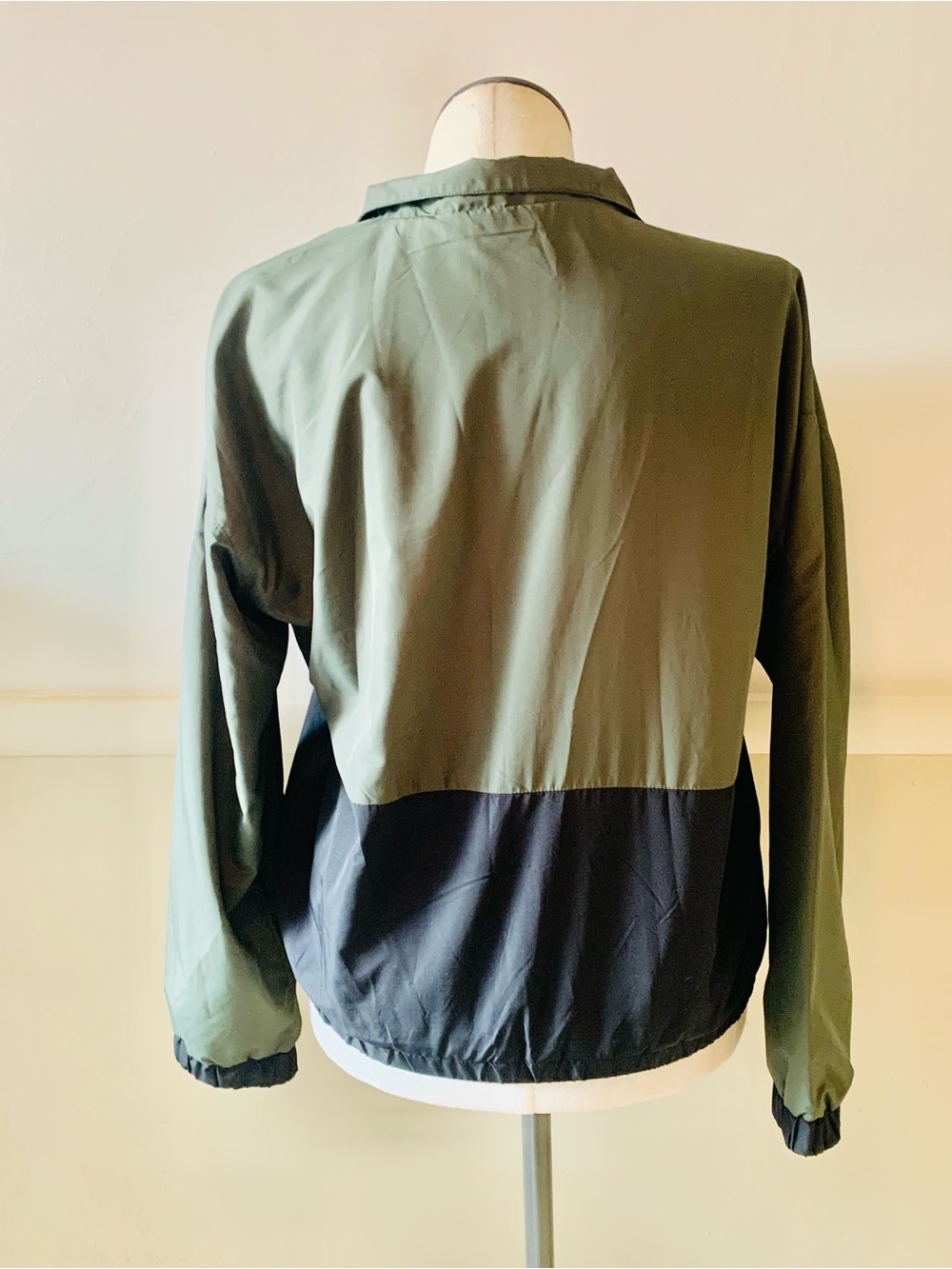 Zyia Active Forest Patch Pocket 1/4-Zip windbreaker in forest green and black. - Picture 3 of 6